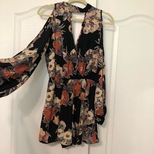 Long sleeve floral romper with shoulder cut out